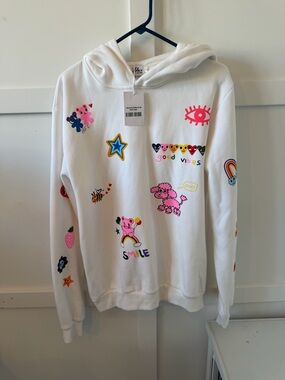 NWT women’s Lola + The Boys White Hoodie with Colorful Cartoon Graphics